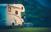 Camper Camping at the Glacier Lake. Camper Van Vacation.