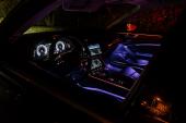 Riga, Latvia 14 November 2018, Audi A6 S line C8 Fifth generation interior dashboard navigation and wheel at night ambient light